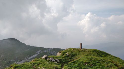 Panoramic view of green landscape against sky