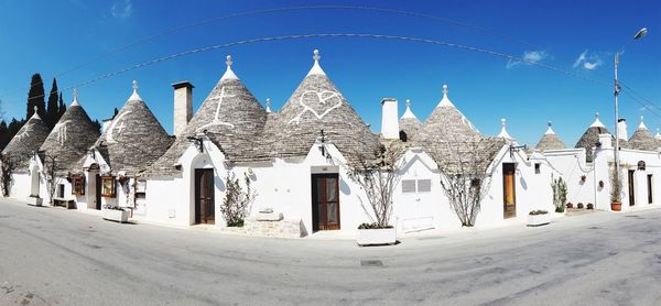 Panoramic view of temple against clear blue sky