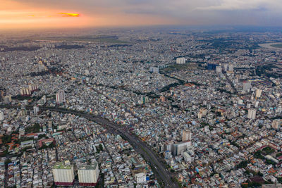 High angle shot of townscape against sky at sunset