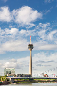 Rhine tower in the harbor called medienhafen at the river rhine in düsseldorf, germany