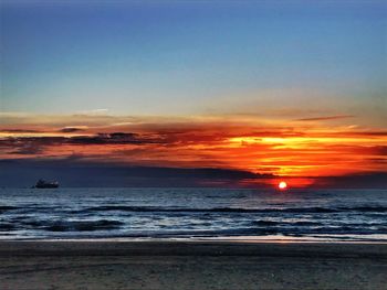 Scenic view of sea against dramatic sky