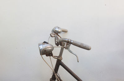 Close-up of bicycle on wall