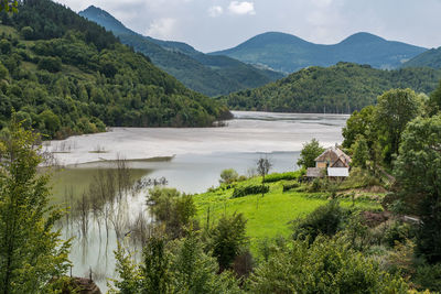 Scenic view of landscape and mountains against sky