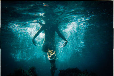 Close-up of man swimming in sea