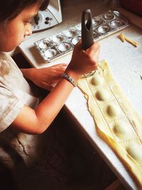 Child making ravioli