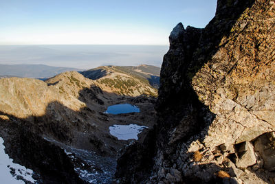 Scenic view of rocky mountains against sky