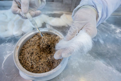 Low section of man washing hands