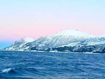 Scenic view of sea against sky during winter