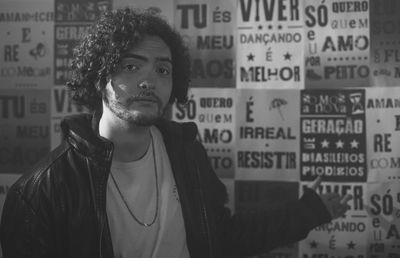 Portrait of young woman standing in city