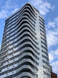 Low angle view of office building against sky