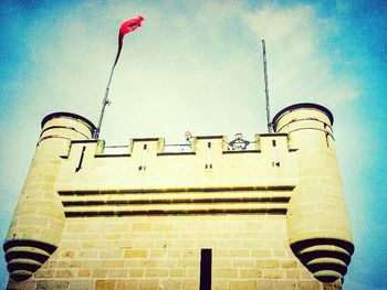 Low angle view of building against blue sky