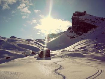 Scenic view of snow mountains against sky
