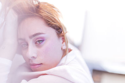 Close-up portrait of beautiful woman at home