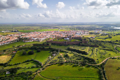 Mourao drone aerial view of castle and village in alentejo landscape, portugal