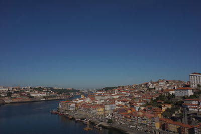 View of cityscape with river in foreground