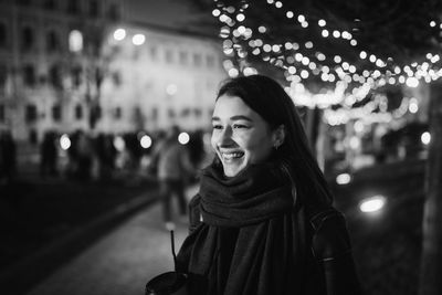 Happy woman at the christmas market at night