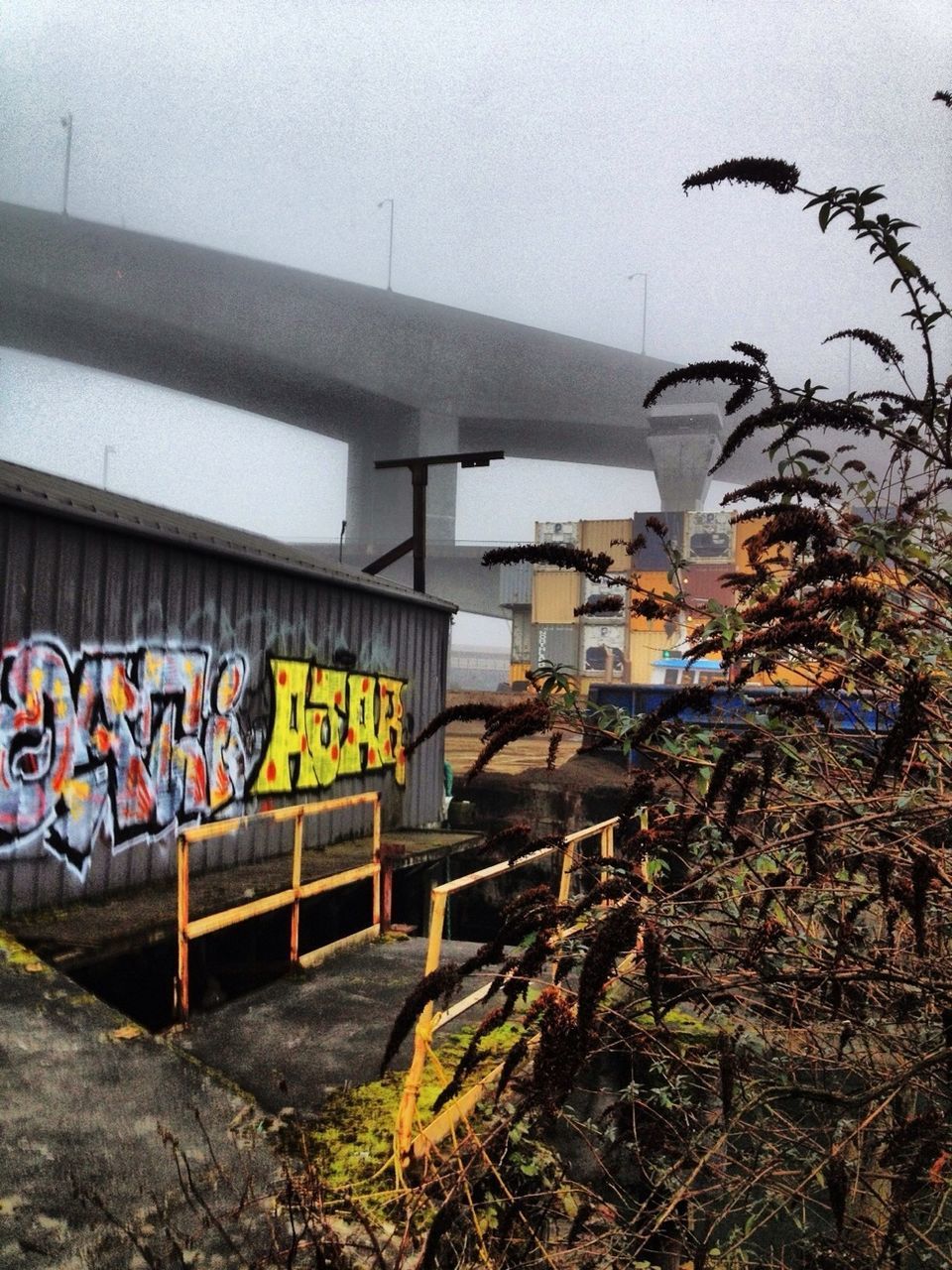 graffiti, text, built structure, transportation, architecture, art, western script, art and craft, wall - building feature, sky, creativity, communication, day, multi colored, outdoors, mode of transport, non-western script, no people, street art, building exterior