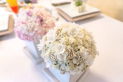 High angle view of white and pink hydrangea in vase at home