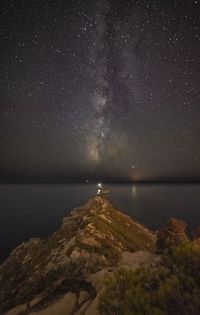 Scenic view of sea against sky at night