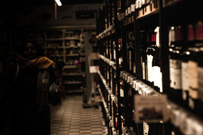 Full frame shot of beer bottles on rack