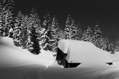 Low angle view of snow covered mountain against sky