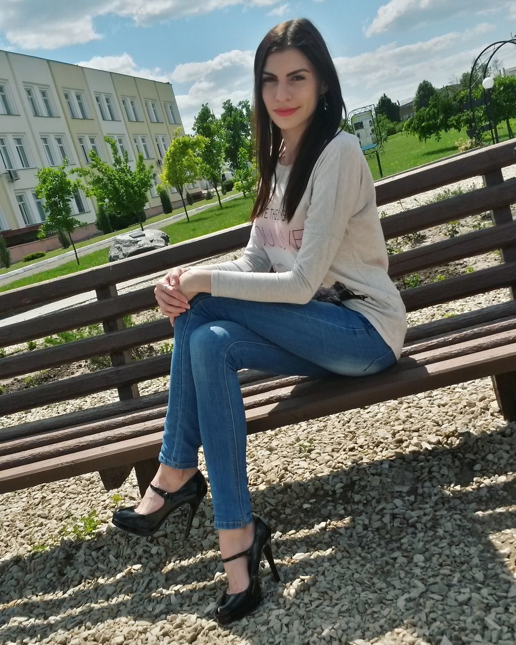 young adult, person, lifestyles, casual clothing, full length, leisure activity, young women, portrait, looking at camera, front view, building exterior, standing, built structure, sunglasses, architecture, sitting, smiling