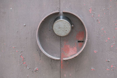 High angle view of rusty metal on wall