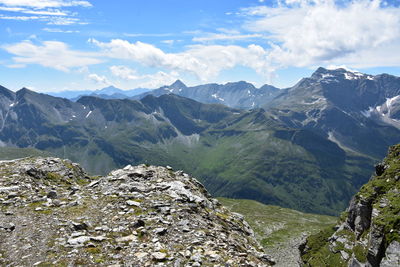 Scenic view of mountains against cloudy sky