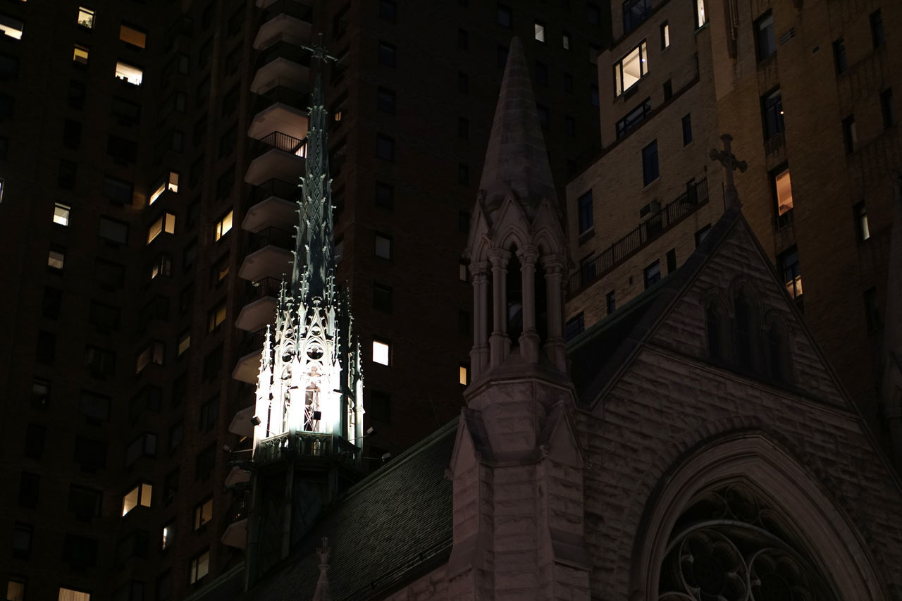 LOW ANGLE VIEW OF ILLUMINATED BUILDINGS AGAINST SKY