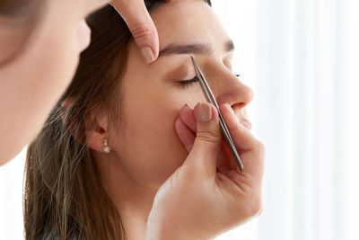 Woman getting eyebrows done