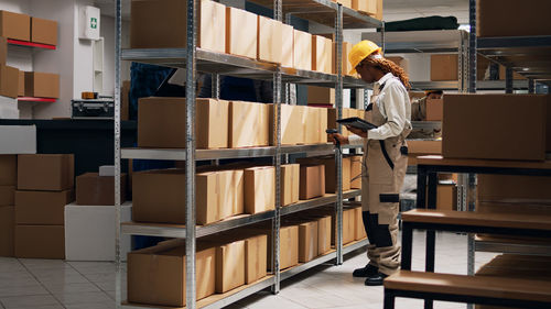 Rear view of man standing in store