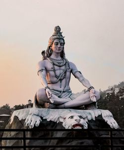 Low angle view of statue against sky