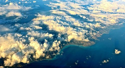 Close-up of airplane in lake against sky