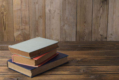 Close-up of books on wooden table