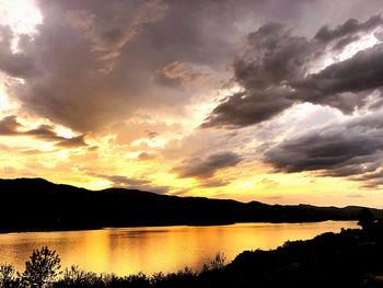 Scenic view of lake against sky during sunset