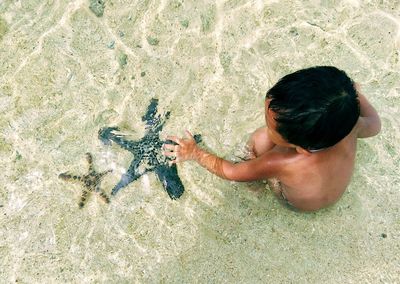 High angle view of boy on beach