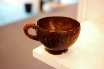 Close-up of coffee cup on table