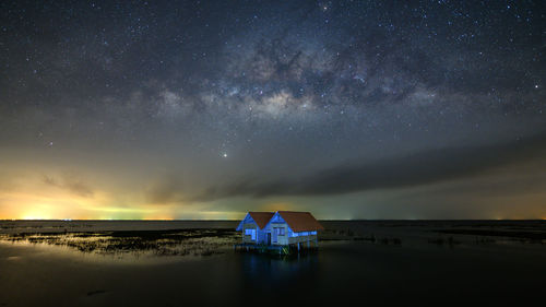 Scenic view of sea against sky at night