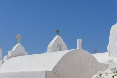 View of white building against blue sky