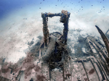 Low angle view of person on sea against sky