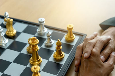 Close-up of chess pieces on table