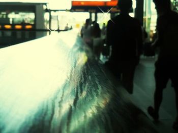 Woman standing by railing