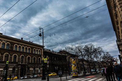 City street against cloudy sky