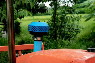 Close-up of air filter in yard