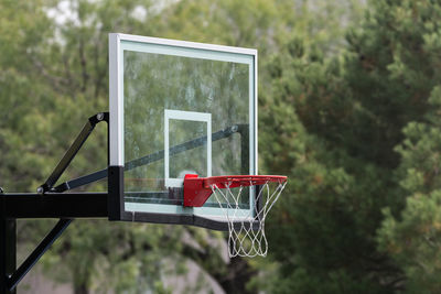 Basketball hoop against trees