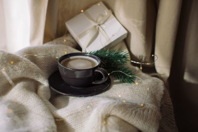 Close-up of tea cup on table at home