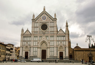 Facade of historic building against sky