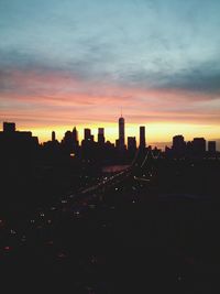 Silhouette of city at sunset