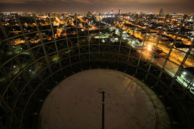 High angle view of illuminated buildings in city at night