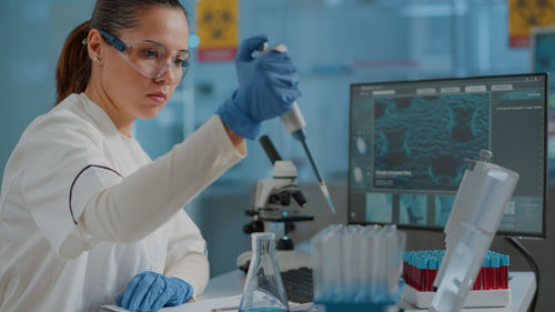 Young female scientist working in laboratory